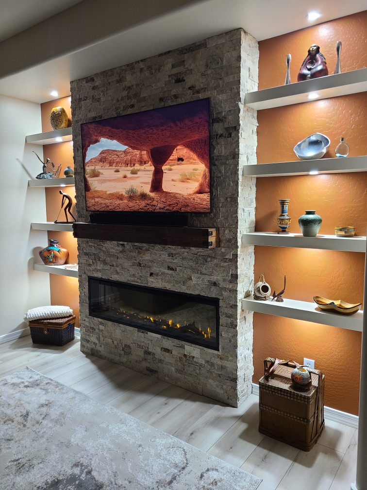 Indoor fireplace wall with floating shelves